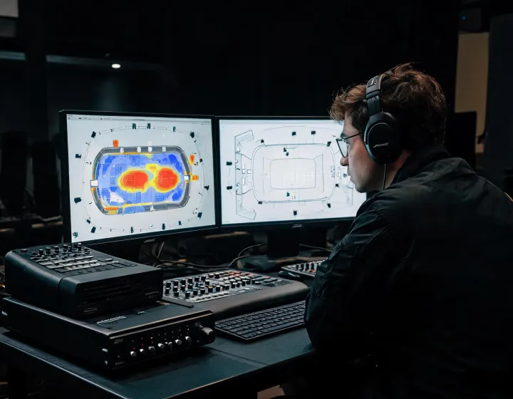 Audio engineer reviewing venue loudspeaker coverage